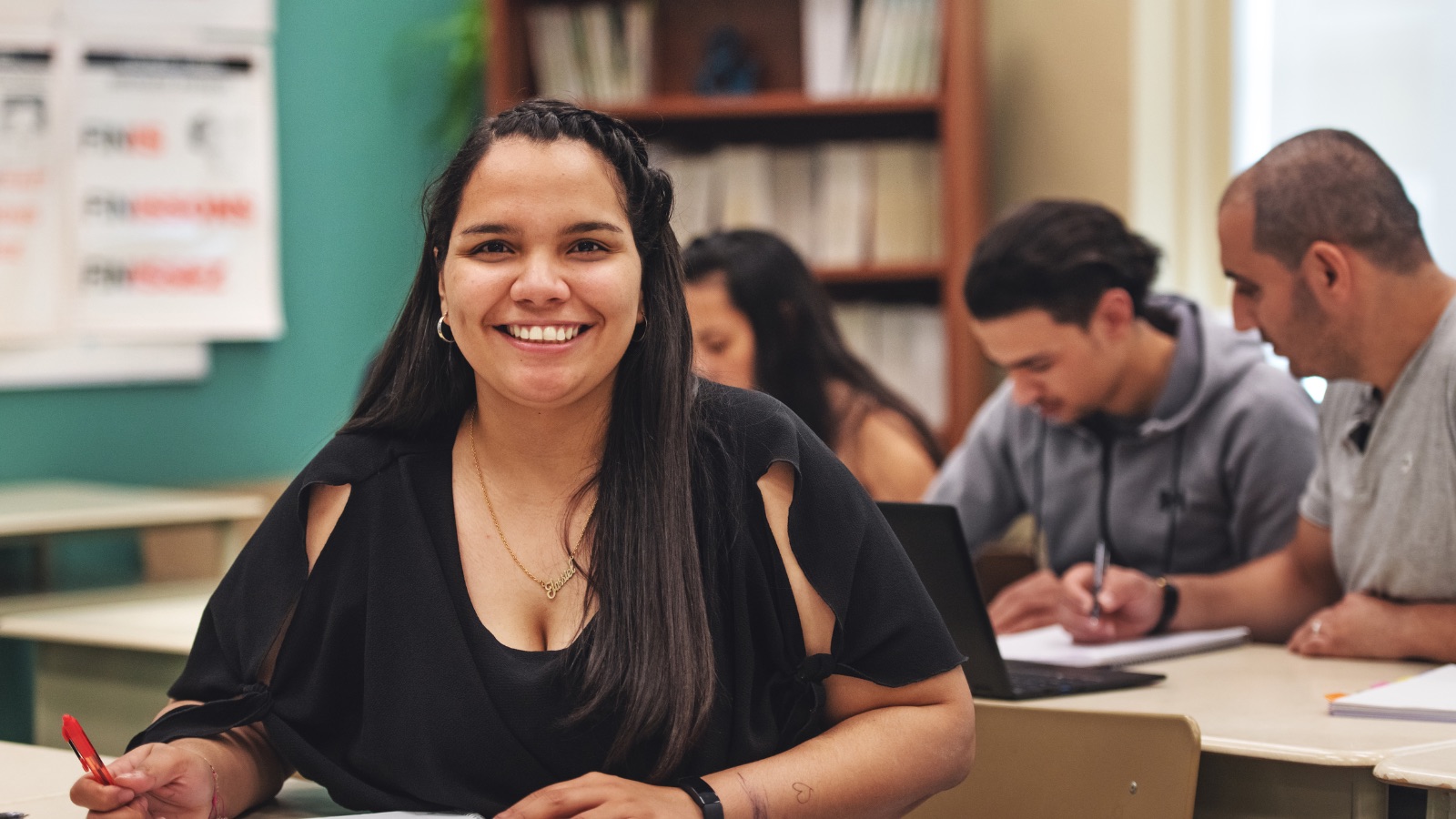 a smiling student in a classroom